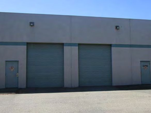 Grade-level roll-up doors on the side of the building